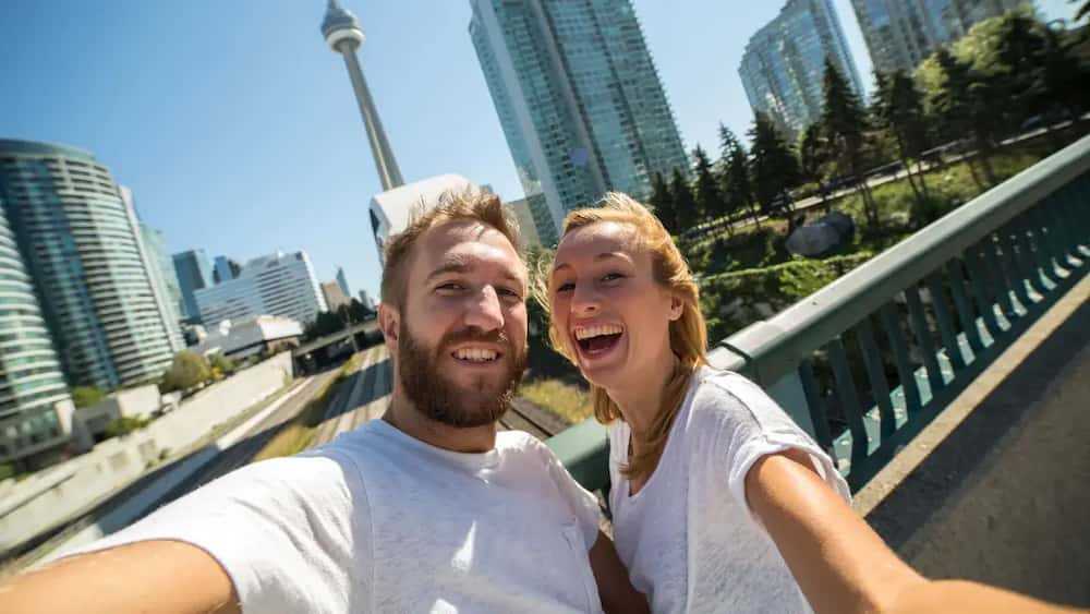 unmatched support from corporate housing team with a satisfied client in front of her laptop 1 037e66db